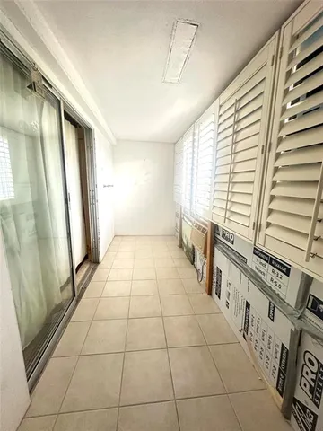 a view of a lake with table and chairs