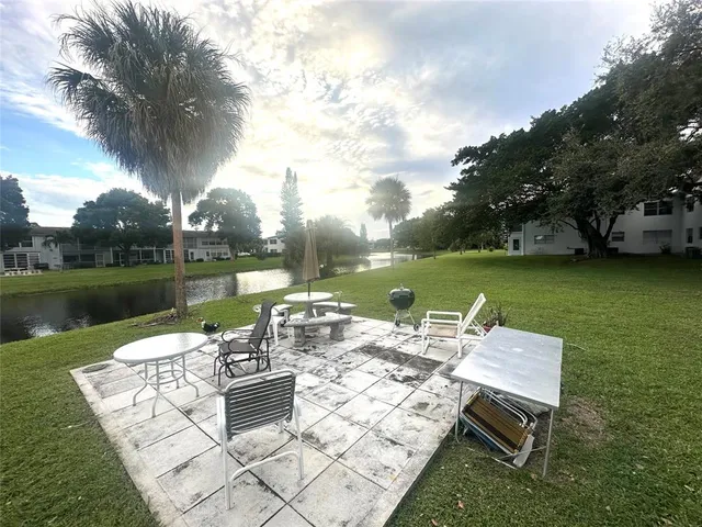 an aerial view of residential houses with outdoor space and river