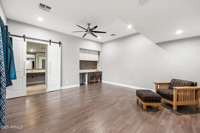 a bedroom with a bed and a view of bathroom