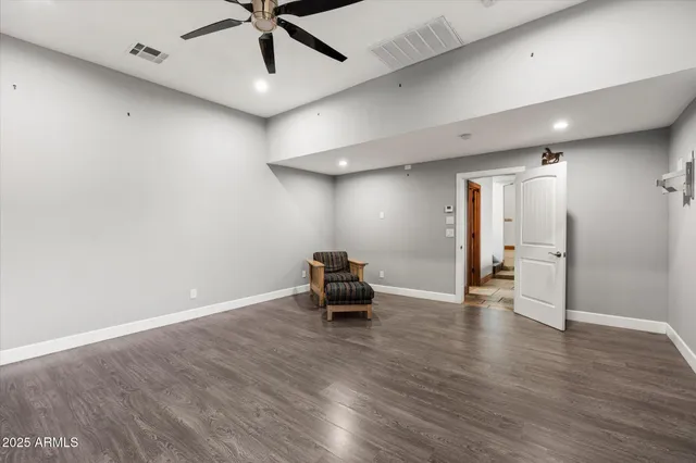 a view of workspace with wooden floor and furniture