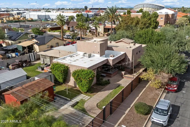 an aerial view of residential houses with outdoor space
