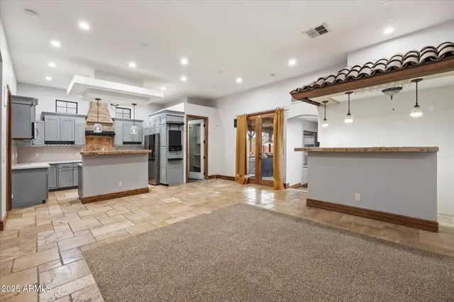 a view of a kitchen with a sink and cabinets