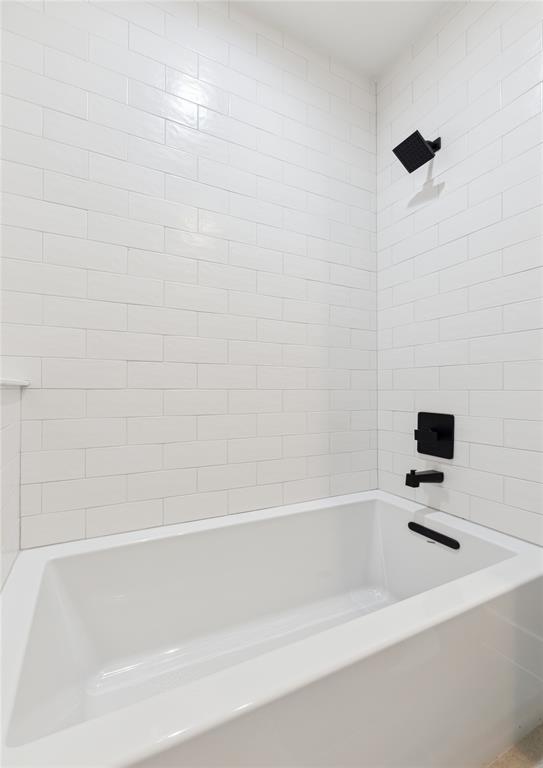 3230 Elihu Street, Unit 5 Dallas, TX 75210 - Photo 11 of 17 a bathroom with a bathtub and white shower
