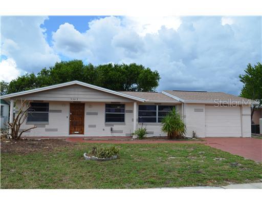 3353 Umber Road Holiday, FL 34691 - Photo 1 of 1 a front view of a house with garden