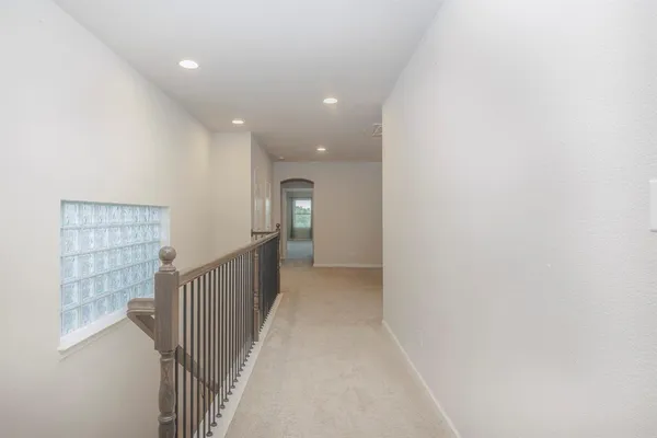 a view of a hallway with windows