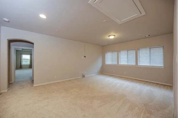 a view of an empty room with a window