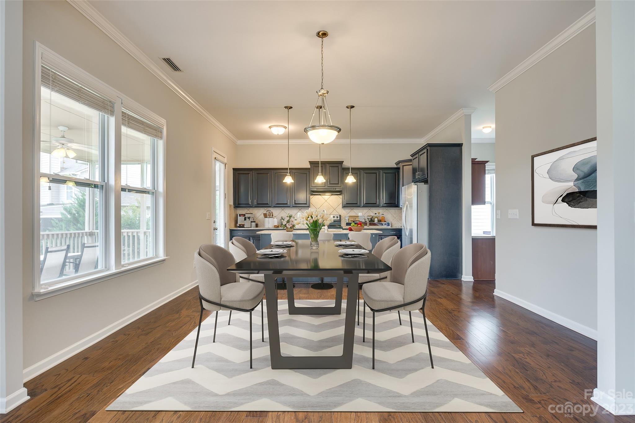 4025 Orchid Way Tega Cay, SC 29708 - Photo 11 of 44 a view of a dining room with furniture window and wooden floor