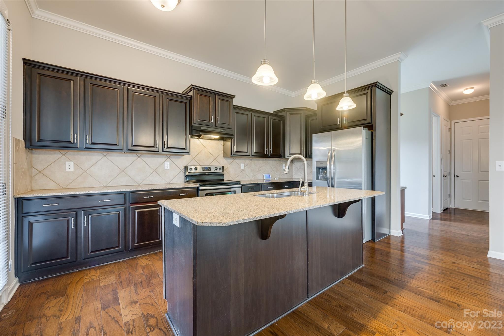 4025 Orchid Way Tega Cay, SC 29708 - Photo 13 of 44 a kitchen with stainless steel appliances granite countertop a sink a stove and a refrigerator