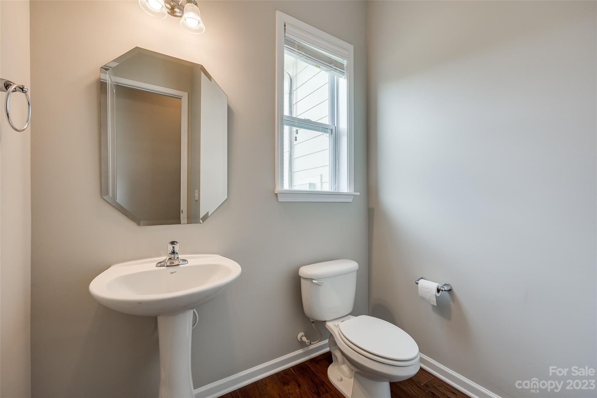 4025 Orchid Way Tega Cay, SC 29708 - Photo 17 of 44 a bathroom with a toilet sink and mirror