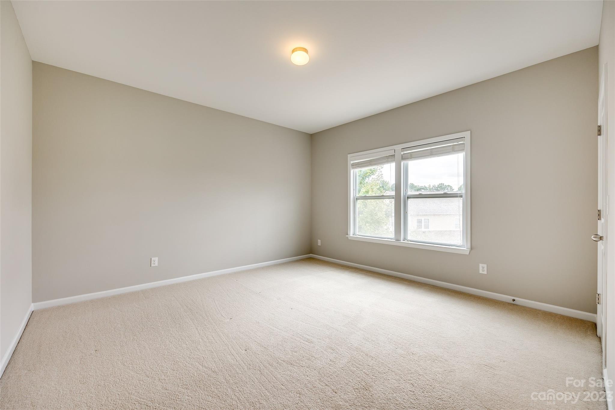 4025 Orchid Way Tega Cay, SC 29708 - Photo 22 of 44 an empty room with a empty space and windows