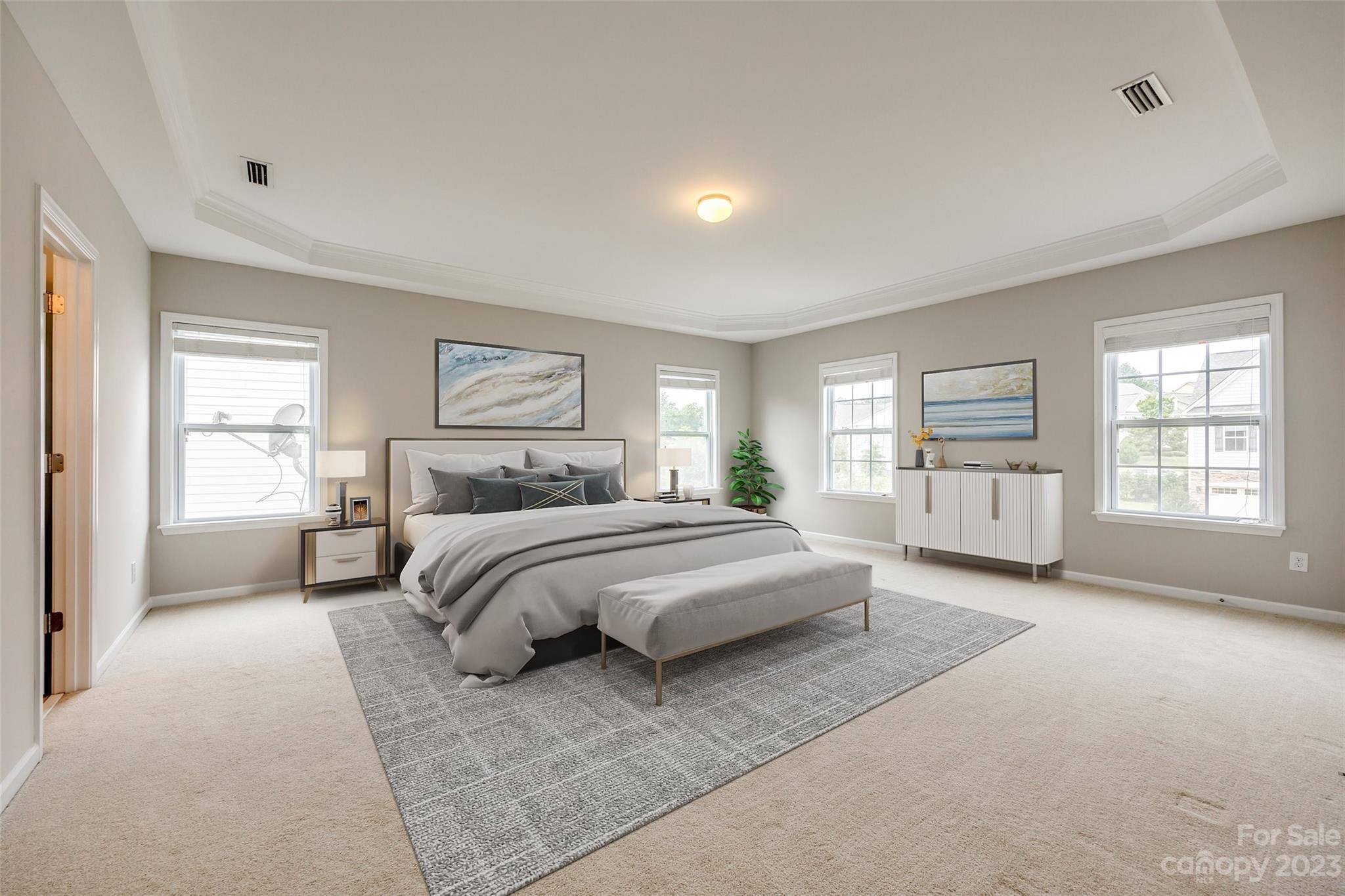 4025 Orchid Way Tega Cay, SC 29708 - Photo 25 of 44 a spacious bedroom with a large bed and a window