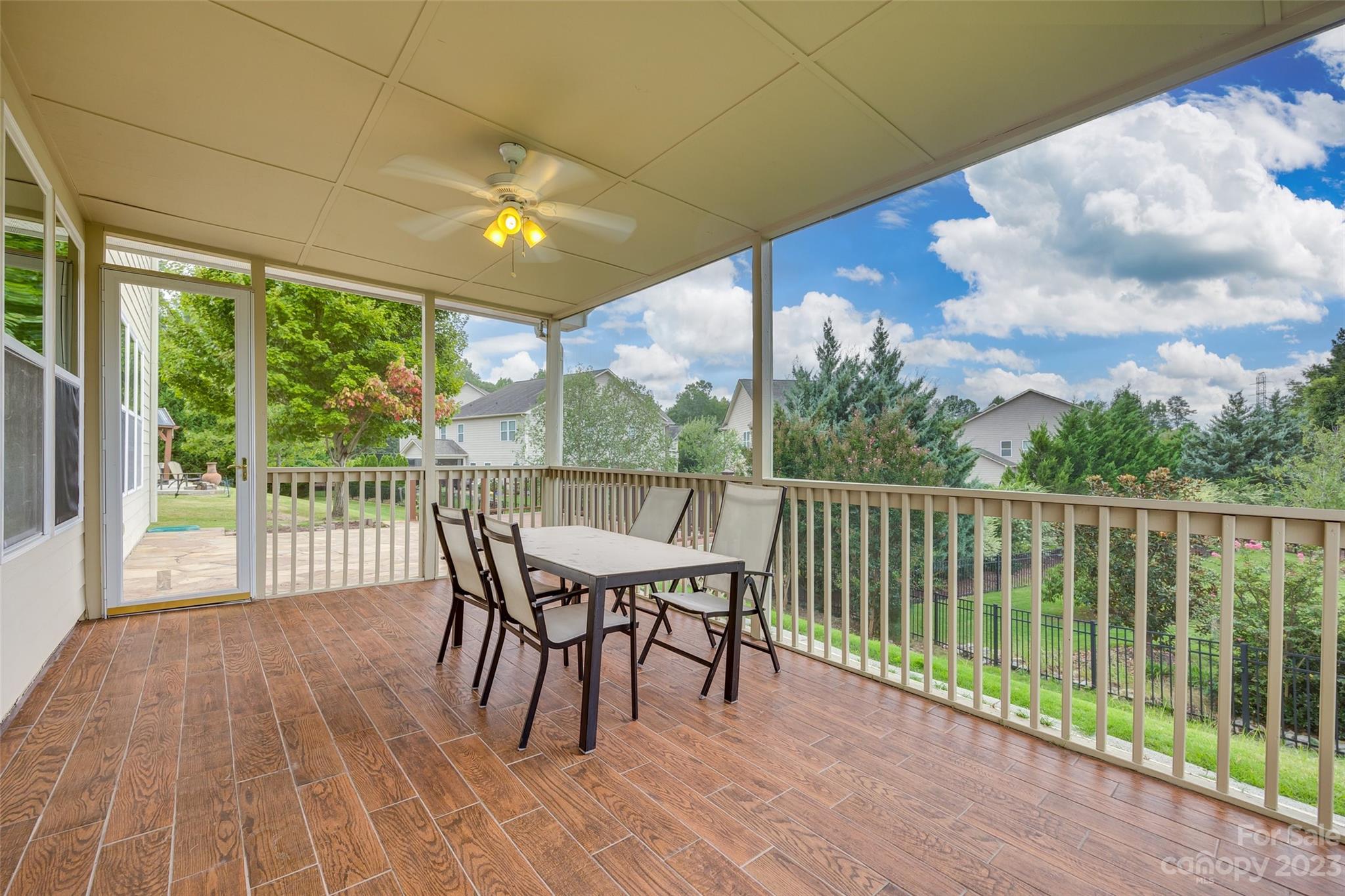 4025 Orchid Way Tega Cay, SC 29708 - Photo 30 of 44 a view of a balcony with furniture and wooden floor