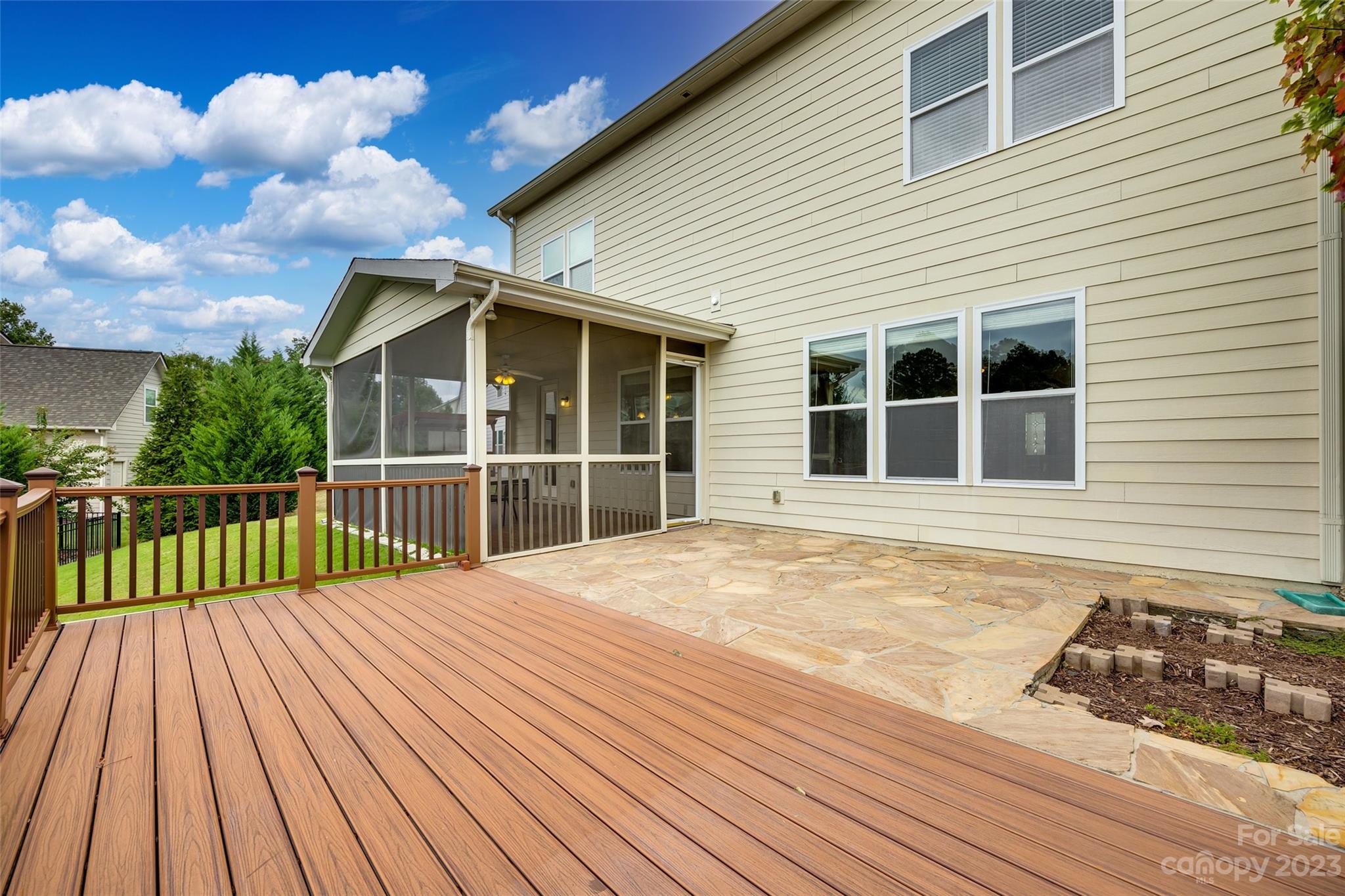 4025 Orchid Way Tega Cay, SC 29708 - Photo 32 of 44 a view of a house with a wooden deck