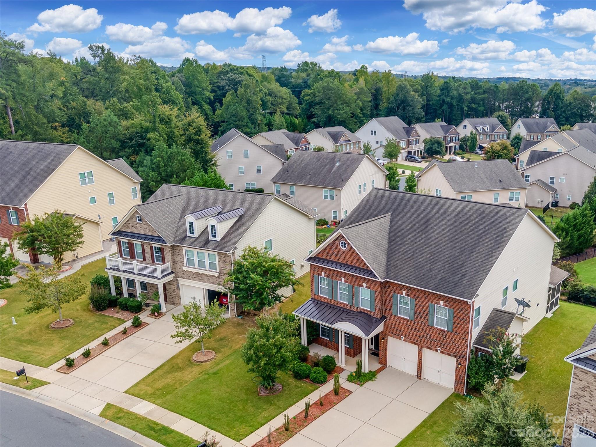 4025 Orchid Way Tega Cay, SC 29708 - Photo 33 of 44 an aerial view of multiple houses with a yard