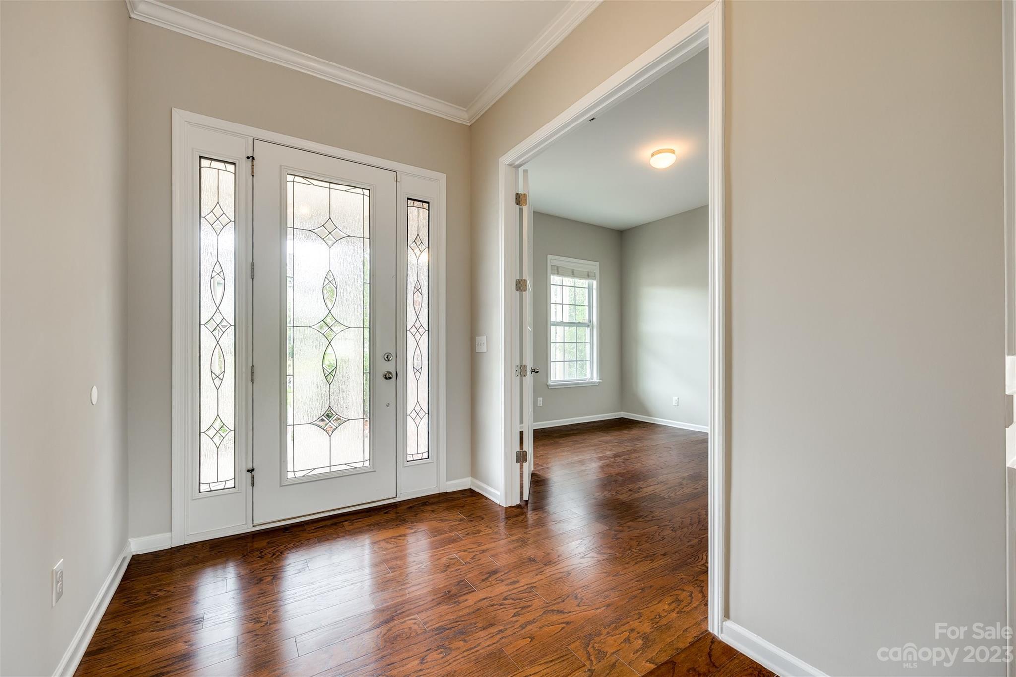 4025 Orchid Way Tega Cay, SC 29708 - Photo 5 of 44 an empty room with wooden floor and windows