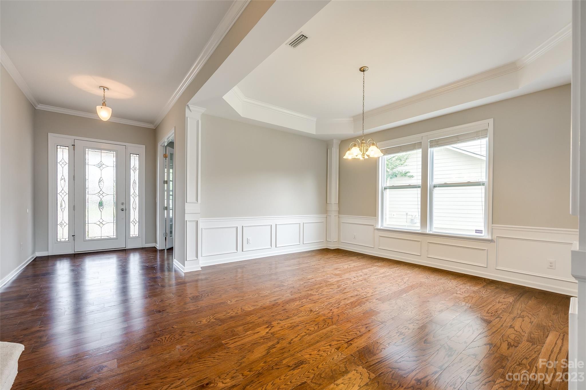 4025 Orchid Way Tega Cay, SC 29708 - Photo 8 of 44 an empty room with wooden floor and windows
