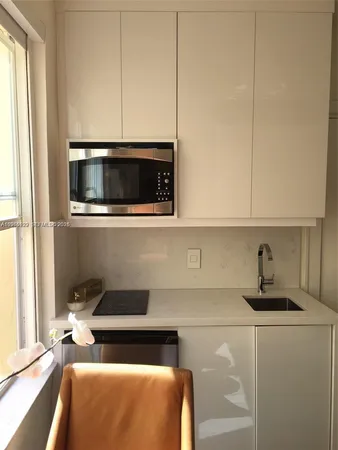 a kitchen with a stove and a microwave