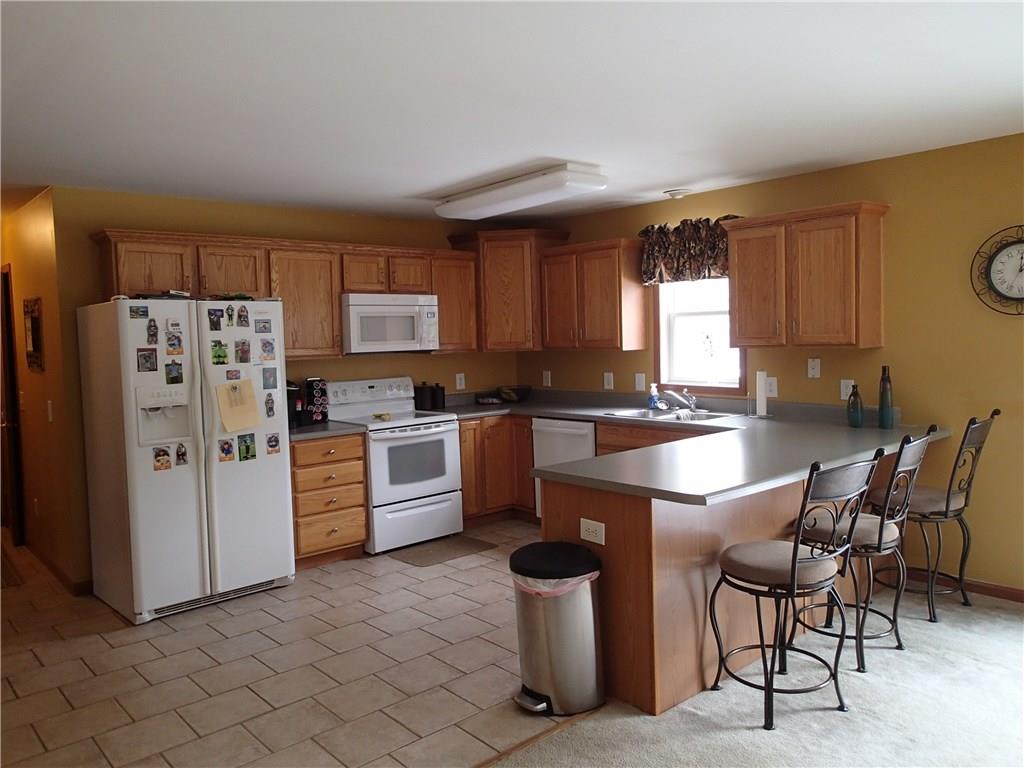 905 Sewickley Road Beaver Falls, PA 15010 - Photo 9 of 24 U shaped kitchen is multi functional with peninsula seating on one side and storage on the other!