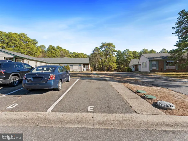 a picture of a wall with a white wall and a white refrigerator