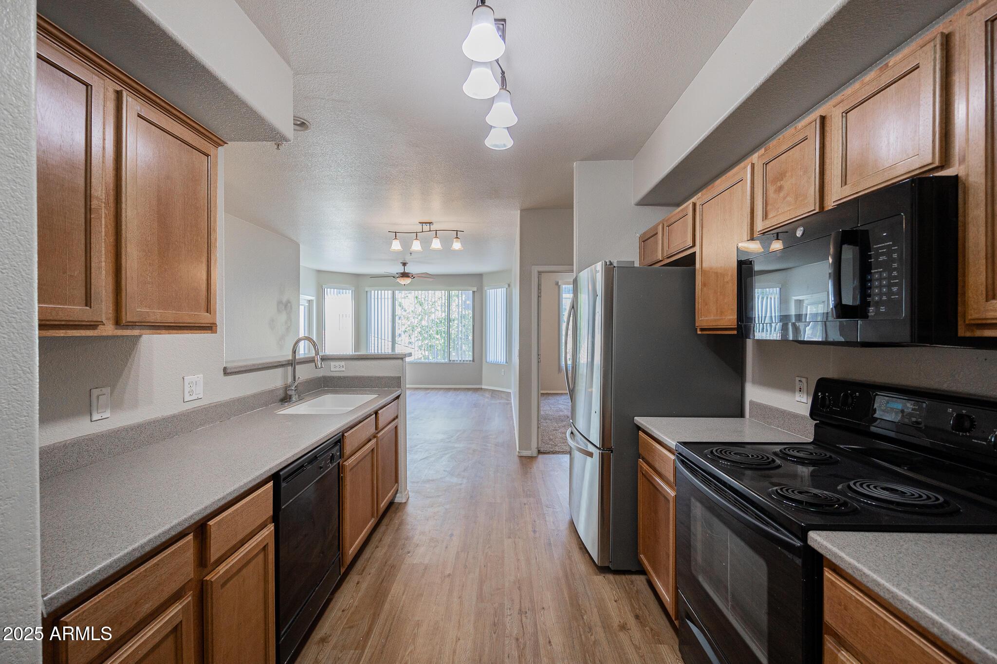 435 West Rio Salado Parkway, Unit 229 Tempe, AZ 85281 - Photo 11 of 26 a kitchen with stainless steel appliances granite countertop a stove a sink dishwasher a refrigerator and a oven