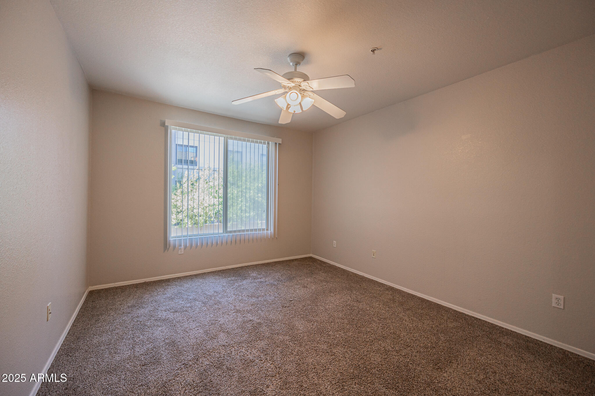 435 West Rio Salado Parkway, Unit 229 Tempe, AZ 85281 - Photo 12 of 26 an empty room with a window and a fan