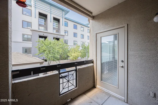 a view of balcony with potted plants