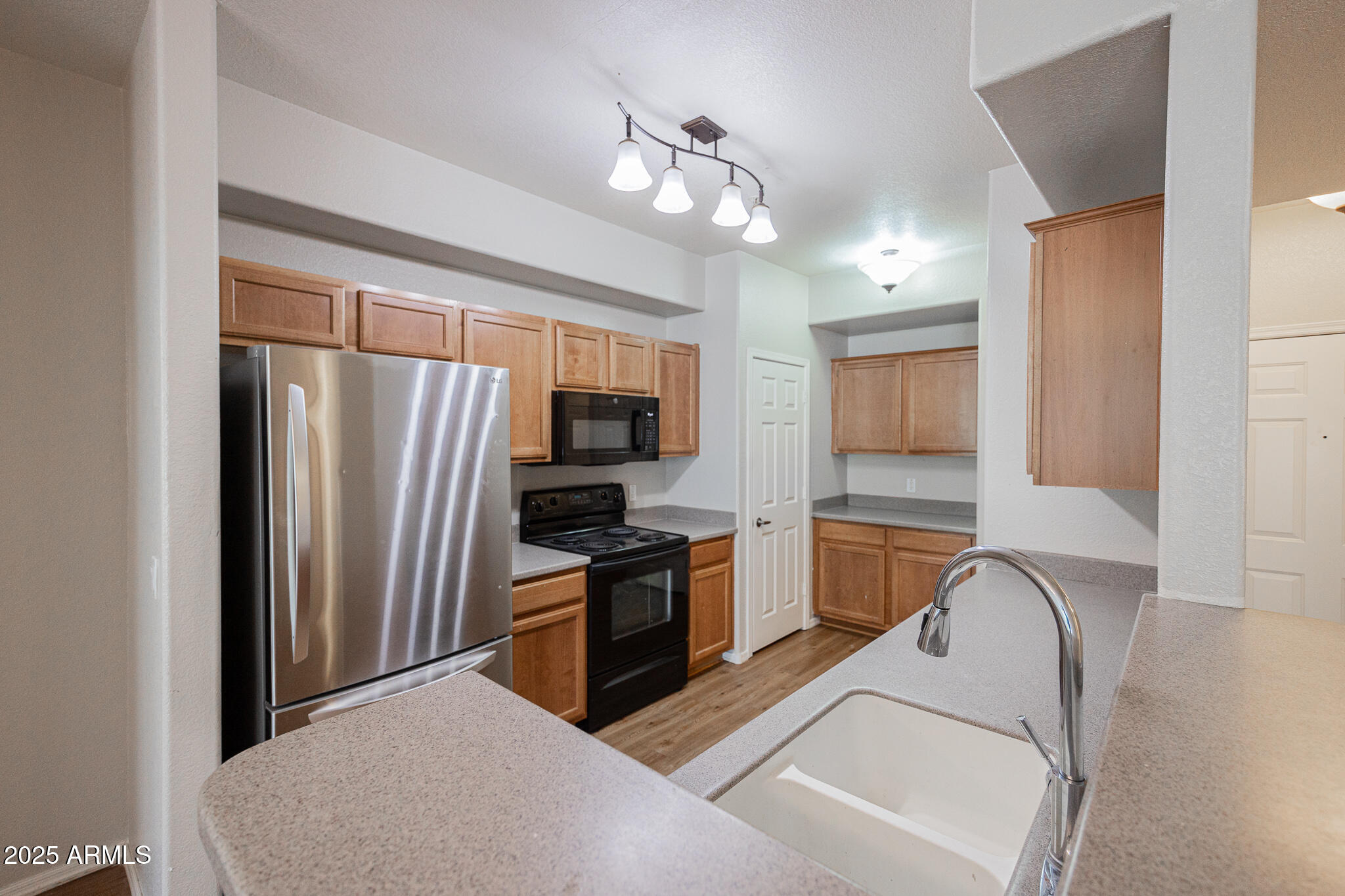 435 West Rio Salado Parkway, Unit 229 Tempe, AZ 85281 - Photo 9 of 26 a living room with stainless steel appliances furniture a flat screen tv and kitchen view