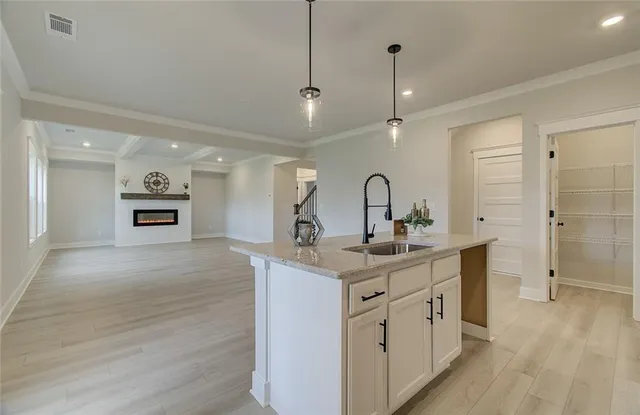 a kitchen with a sink a counter space and appliances