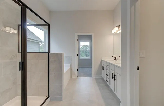 a bathroom with a bathtub and shower