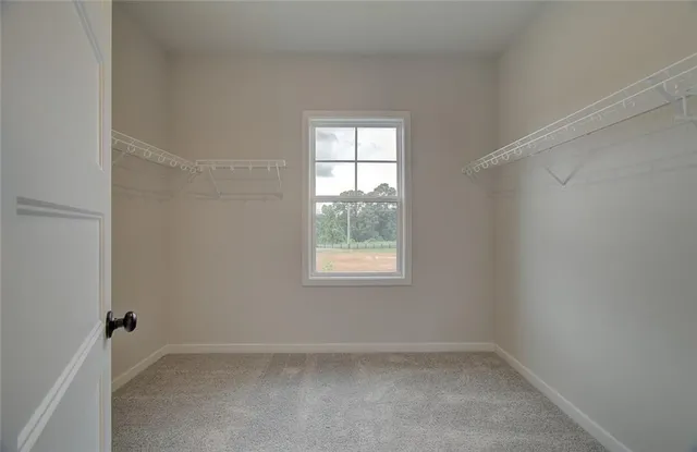 a view of a hallway with a room