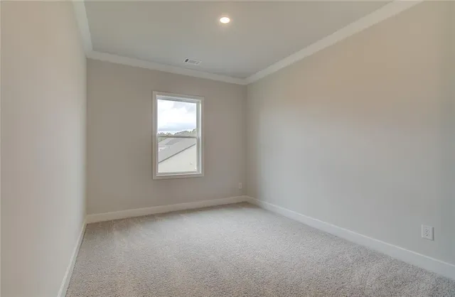 a view of swimming pool with seating space and wooden fence