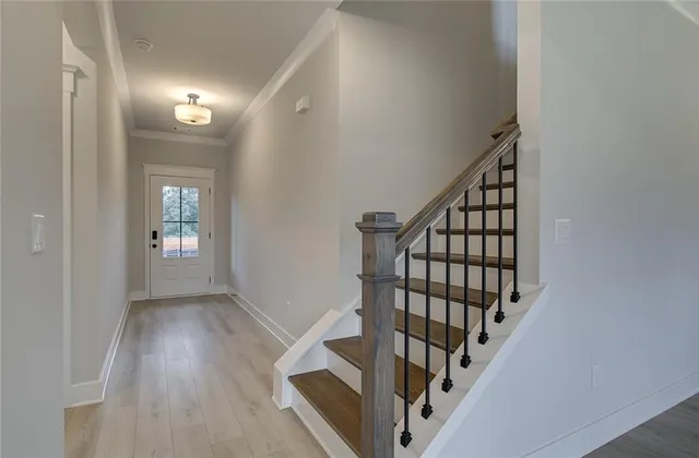 a view of an entryway with wooden floor