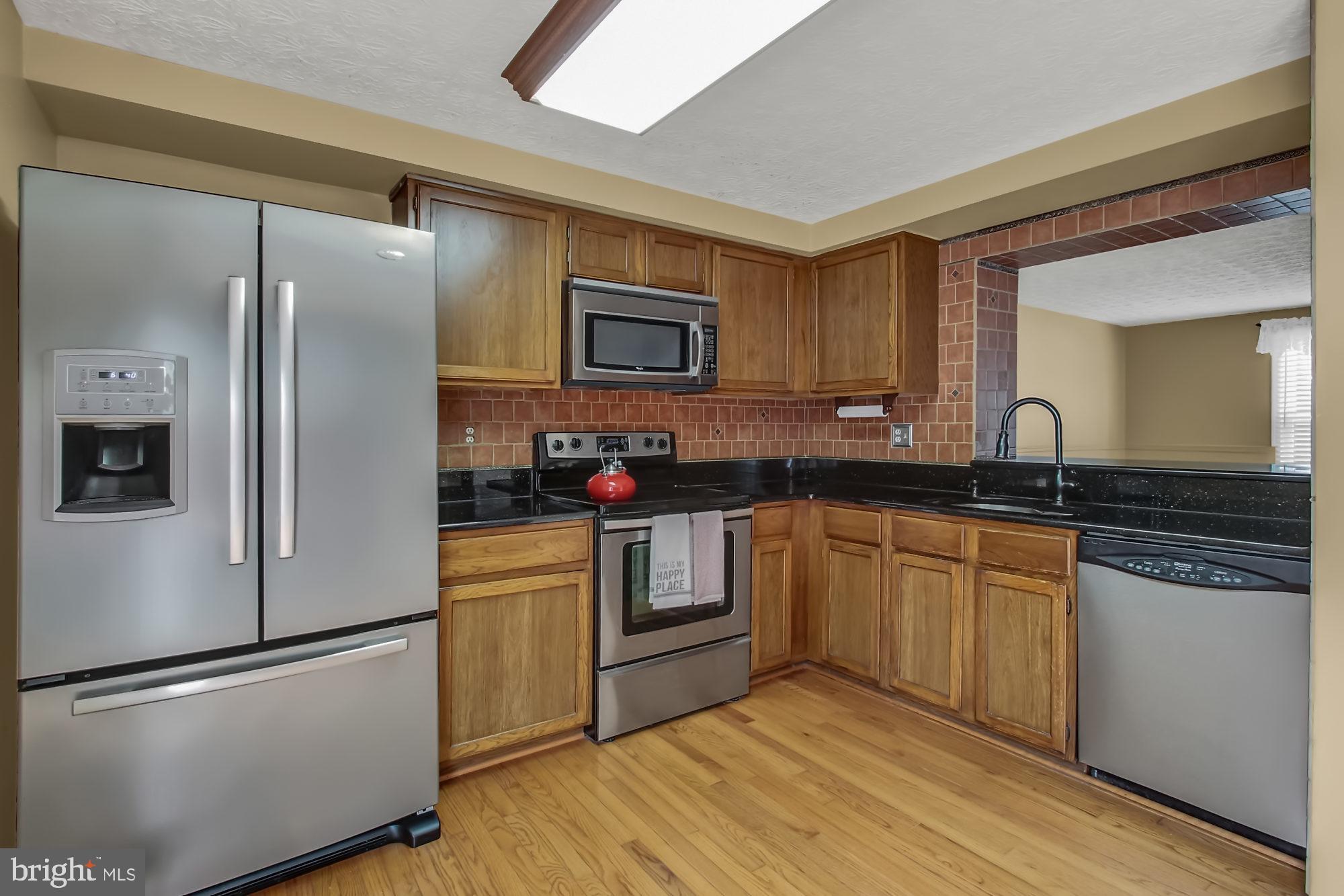 15 Greenleaf Road Baltimore, MD 21234 - Photo 11 of 34 Stainless appliances & stone counters