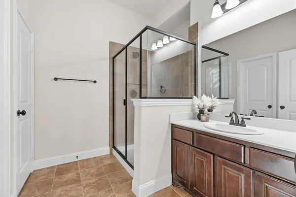 a bathroom with a sink and mirror