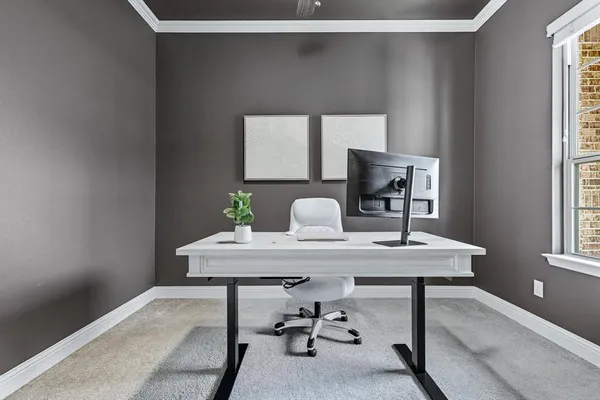 a view of a workspace with furniture