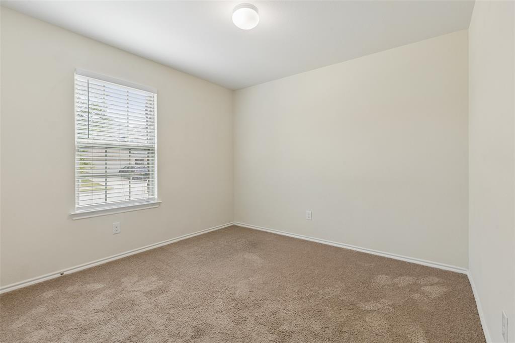 2850 Dusty Road Forney, TX 75126 - Photo 2 of 11 Neutral tone walls with white trim
