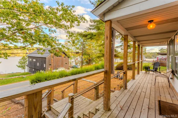 a view of balcony with furniture and wooden floor