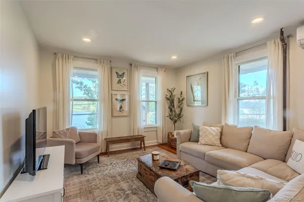 a living room with furniture and a window
