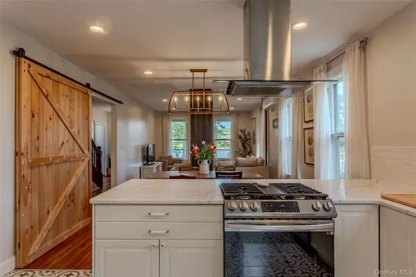 a view of a kitchen with a stove and a refrigerator