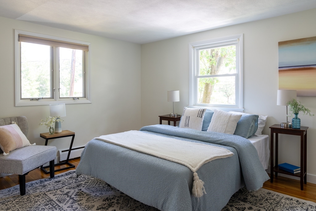 26 Hodge Road Arlington, MA 02474 - Photo 11 of 17 a bed room with a bed and a chair