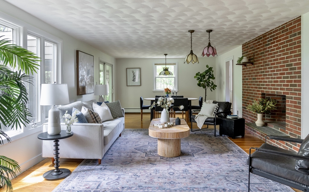26 Hodge Road Arlington, MA 02474 - Photo 2 of 17 a living room with furniture a window and a fireplace