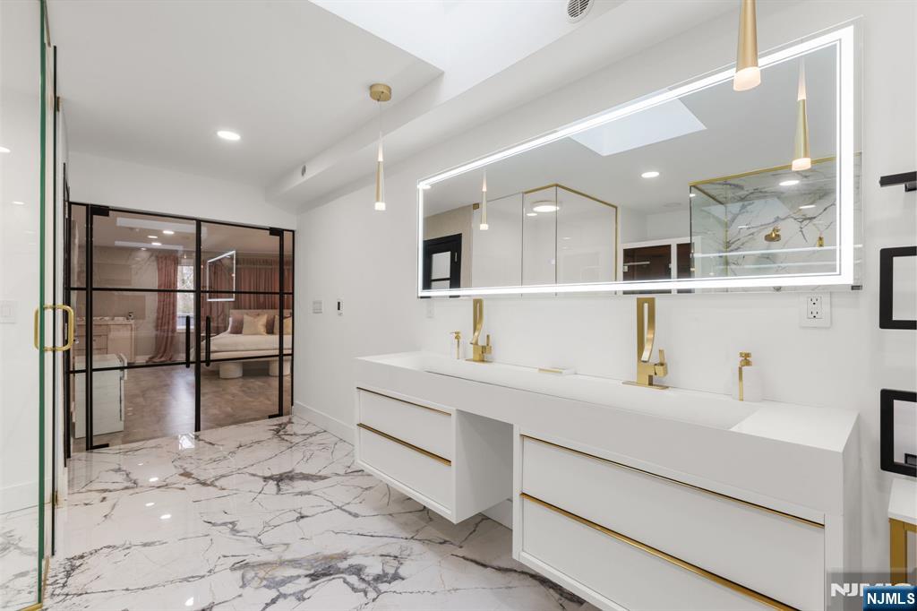 12 Smoke Rise Road Butler, NJ 07405 - Photo 12 of 21 a kitchen with a sink stainless steel appliances and cabinets