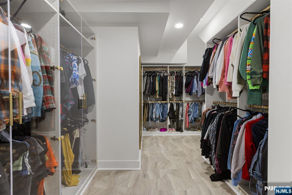 12 Smoke Rise Road Butler, NJ 07405 - Photo 13 of 21 a view of walk in closet with clothes and shoes
