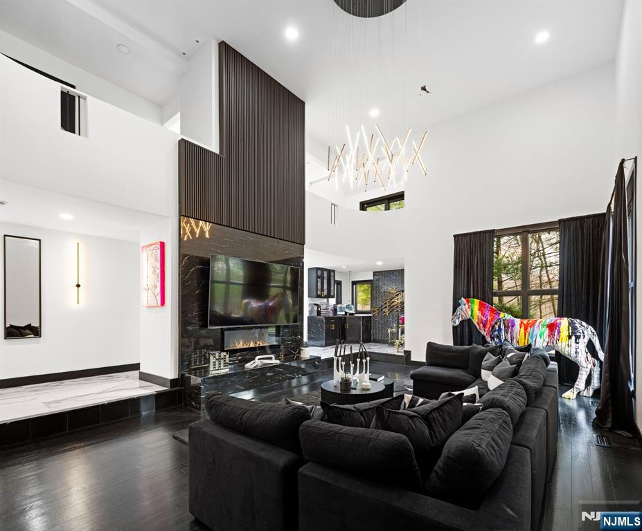 12 Smoke Rise Road Butler, NJ 07405 - Photo 6 of 21 a living room with furniture and a flat screen tv