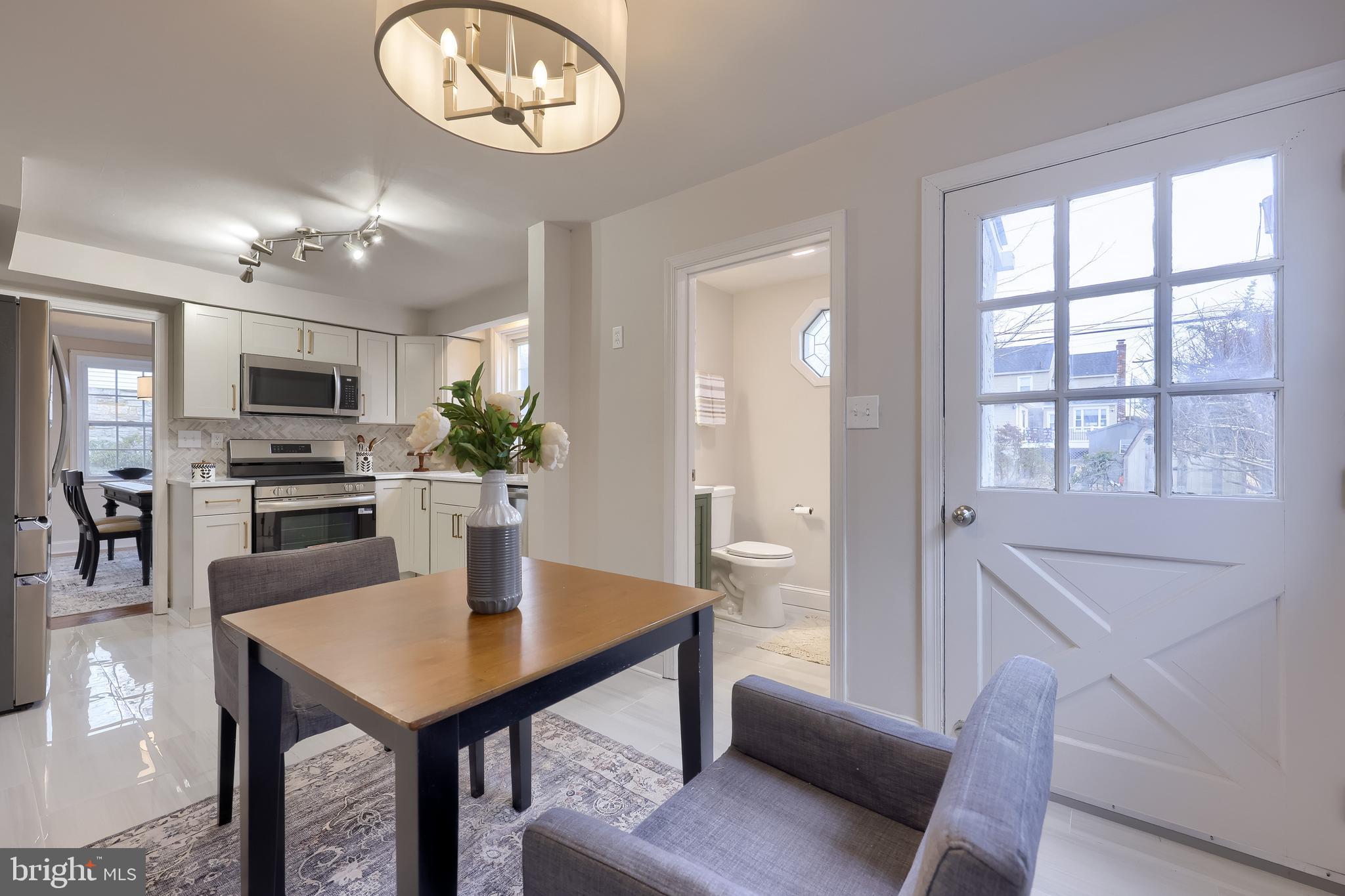 31 Wayfield Road Springfield, PA 19064 - Photo 22 of 49 a view of a dining room with furniture and a chandelier