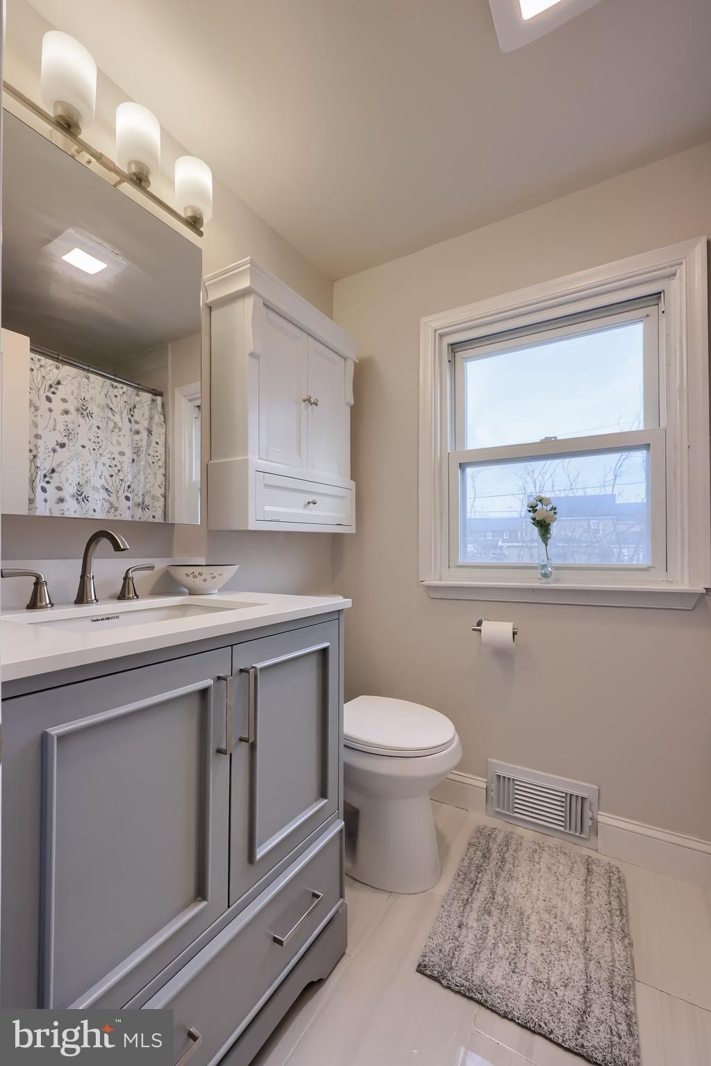 31 Wayfield Road Springfield, PA 19064 - Photo 27 of 49 a bathroom with a toilet a sink and mirror