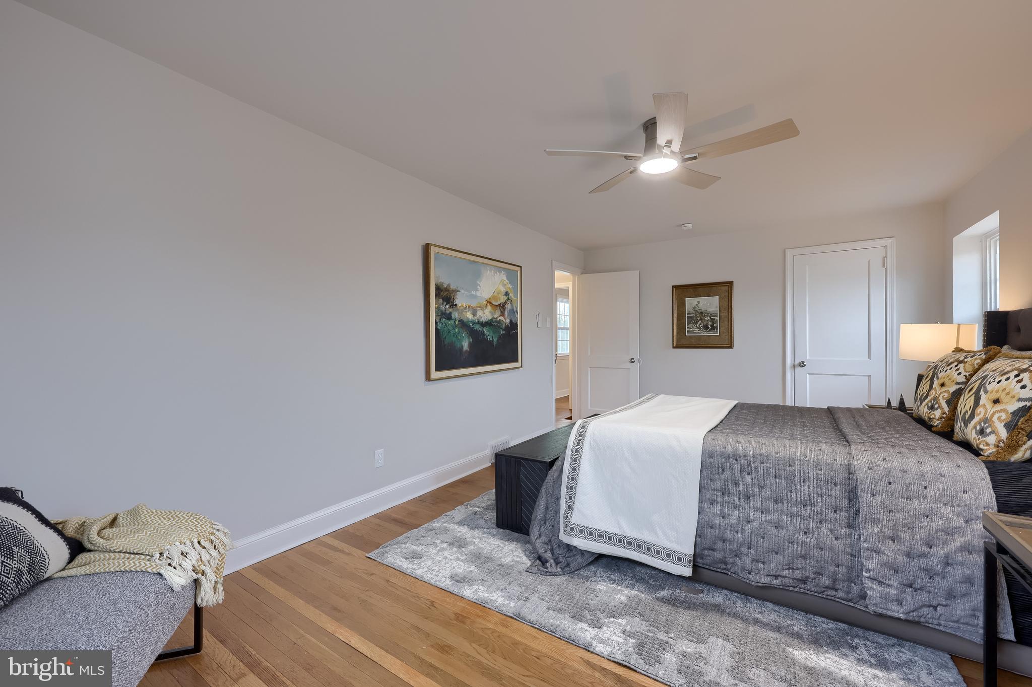 31 Wayfield Road Springfield, PA 19064 - Photo 30 of 49 a bedroom with a bed and a chandelier