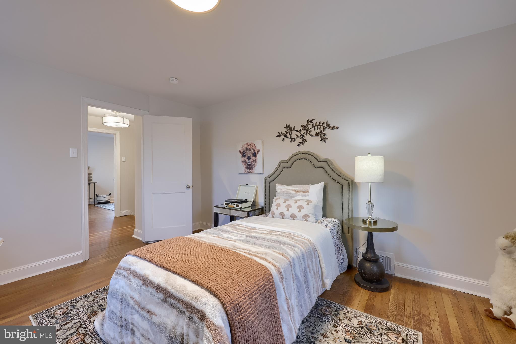 31 Wayfield Road Springfield, PA 19064 - Photo 35 of 49 a bedroom with a bed and a chandelier