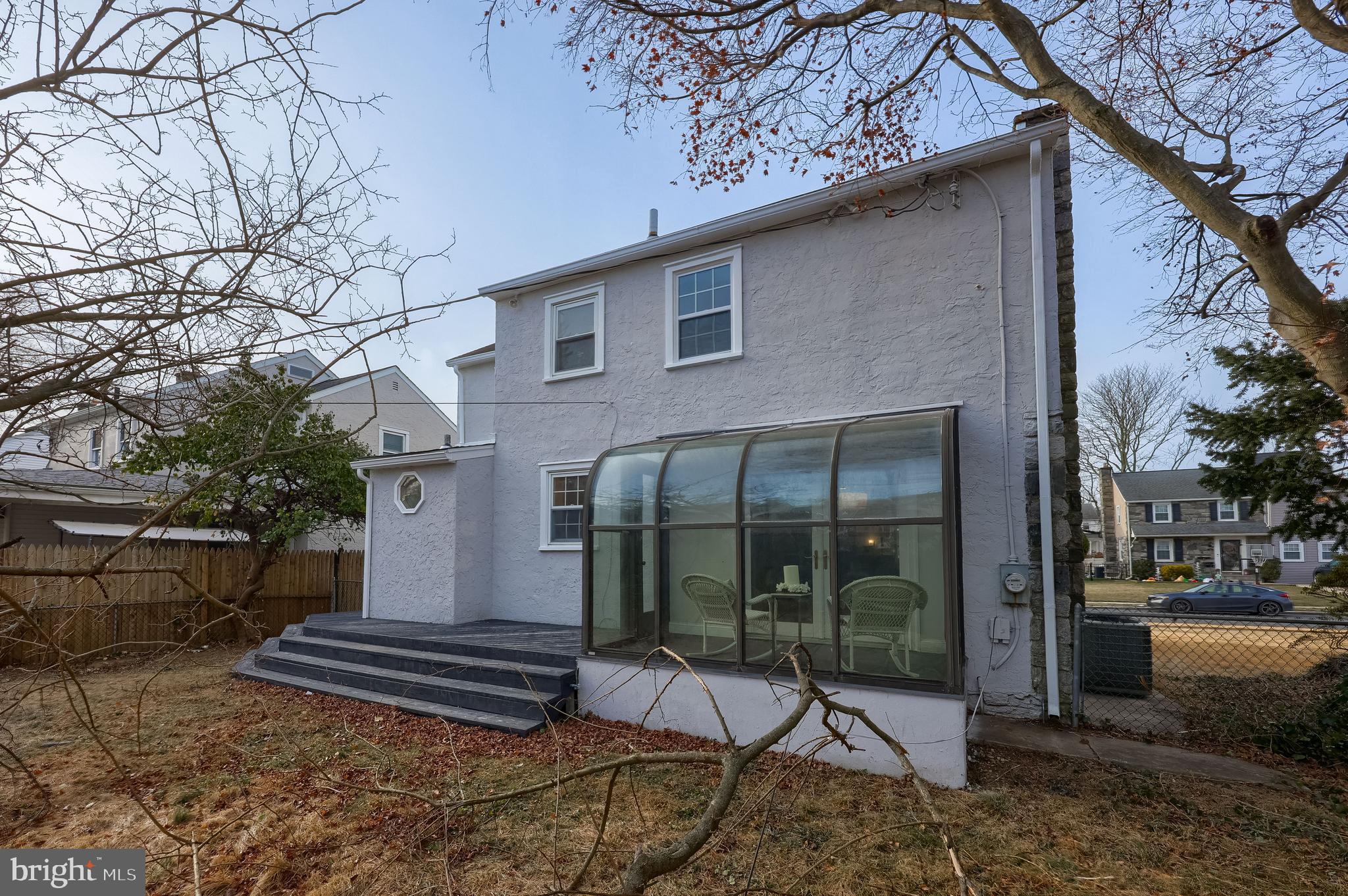 31 Wayfield Road Springfield, PA 19064 - Photo 37 of 49 a view of a patio with table and chairs and floor to ceiling window