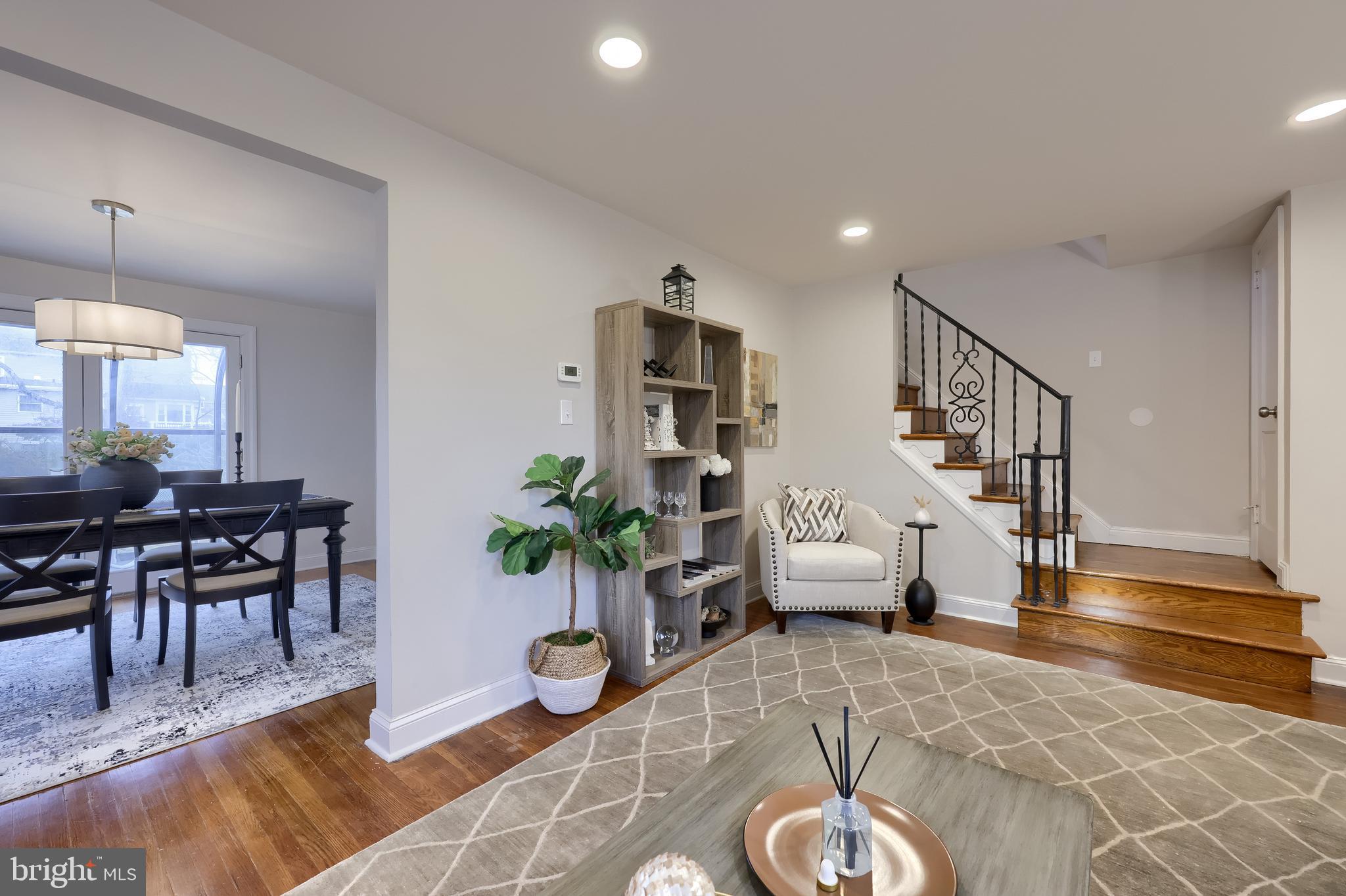 31 Wayfield Road Springfield, PA 19064 - Photo 8 of 49 a living room with furniture and a chandelier